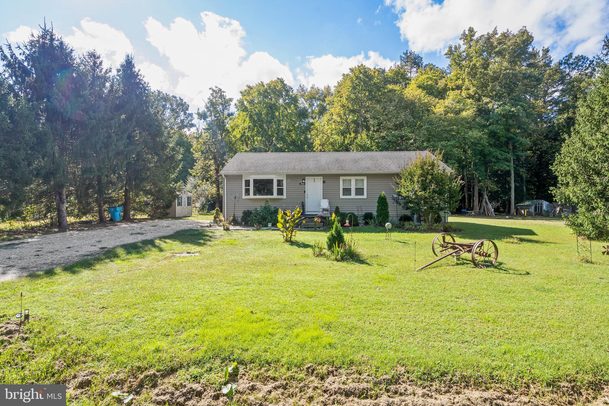 a view of a house with swimming pool and sitting area