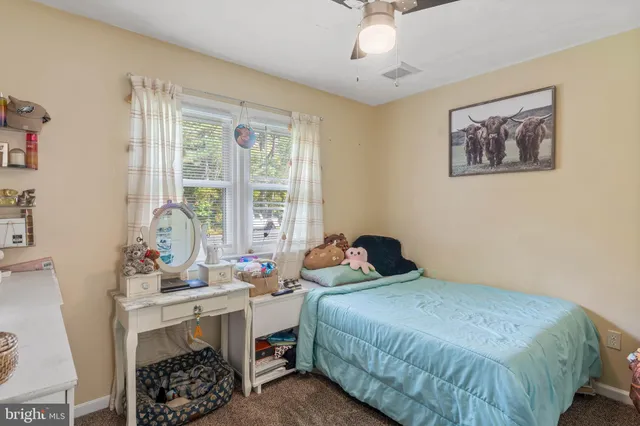 a bedroom with a bed and a table