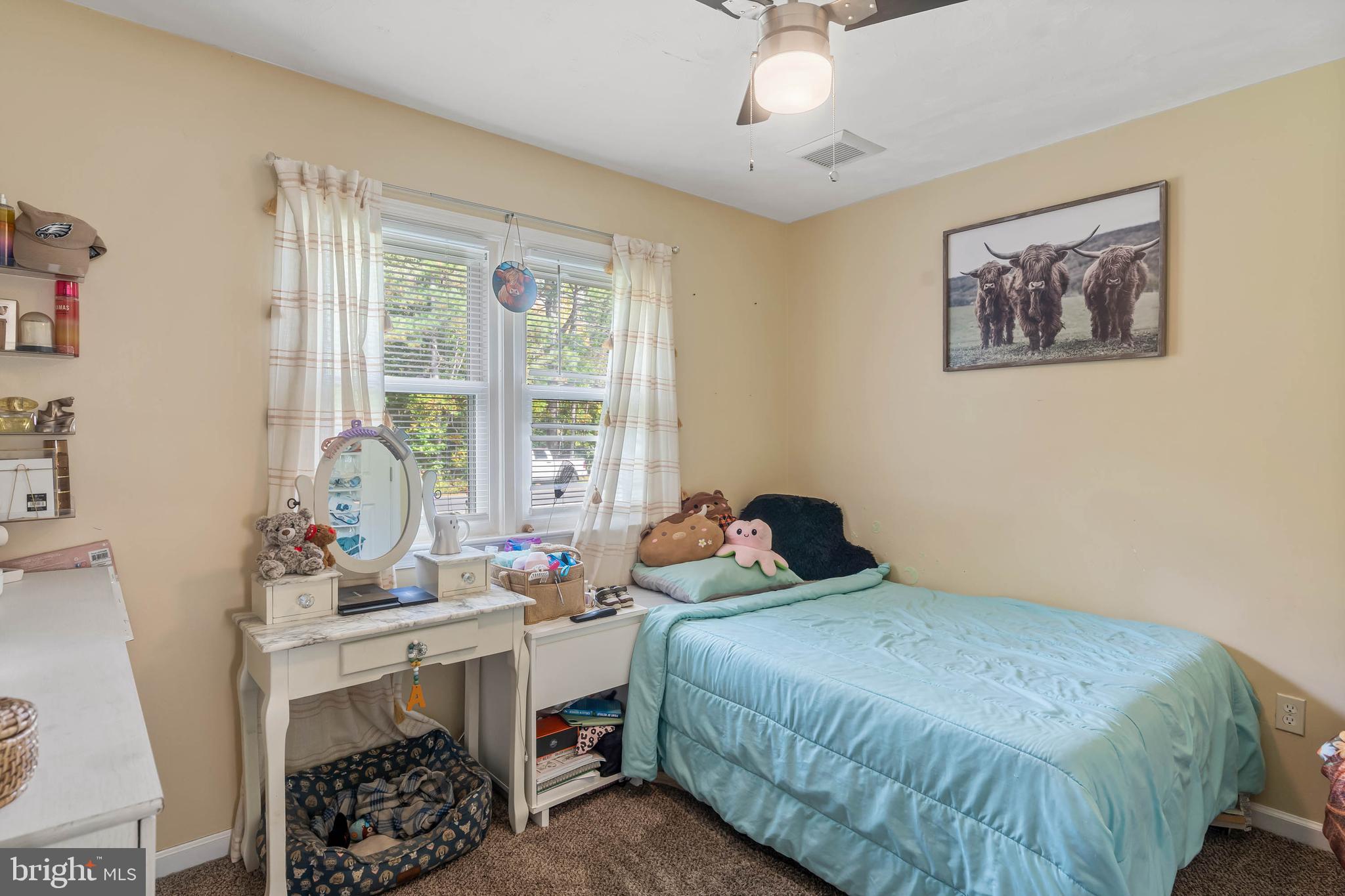 32197 Johnson Road Salisbury, MD 21804 - Photo 14 of 23 a bedroom with a bed and a table