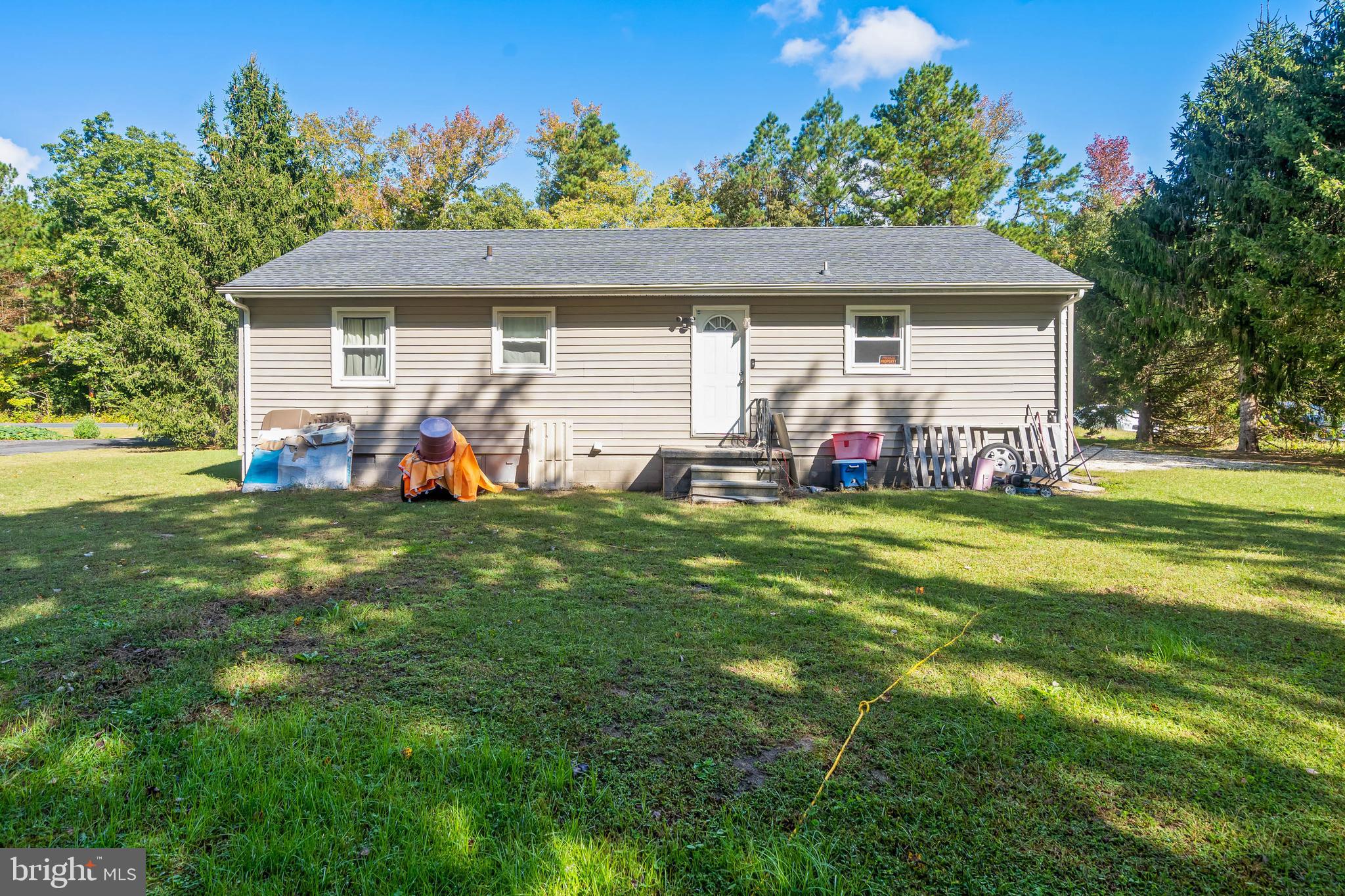 32197 Johnson Road Salisbury, MD 21804 - Photo 21 of 23 a front view of house with garden and trees
