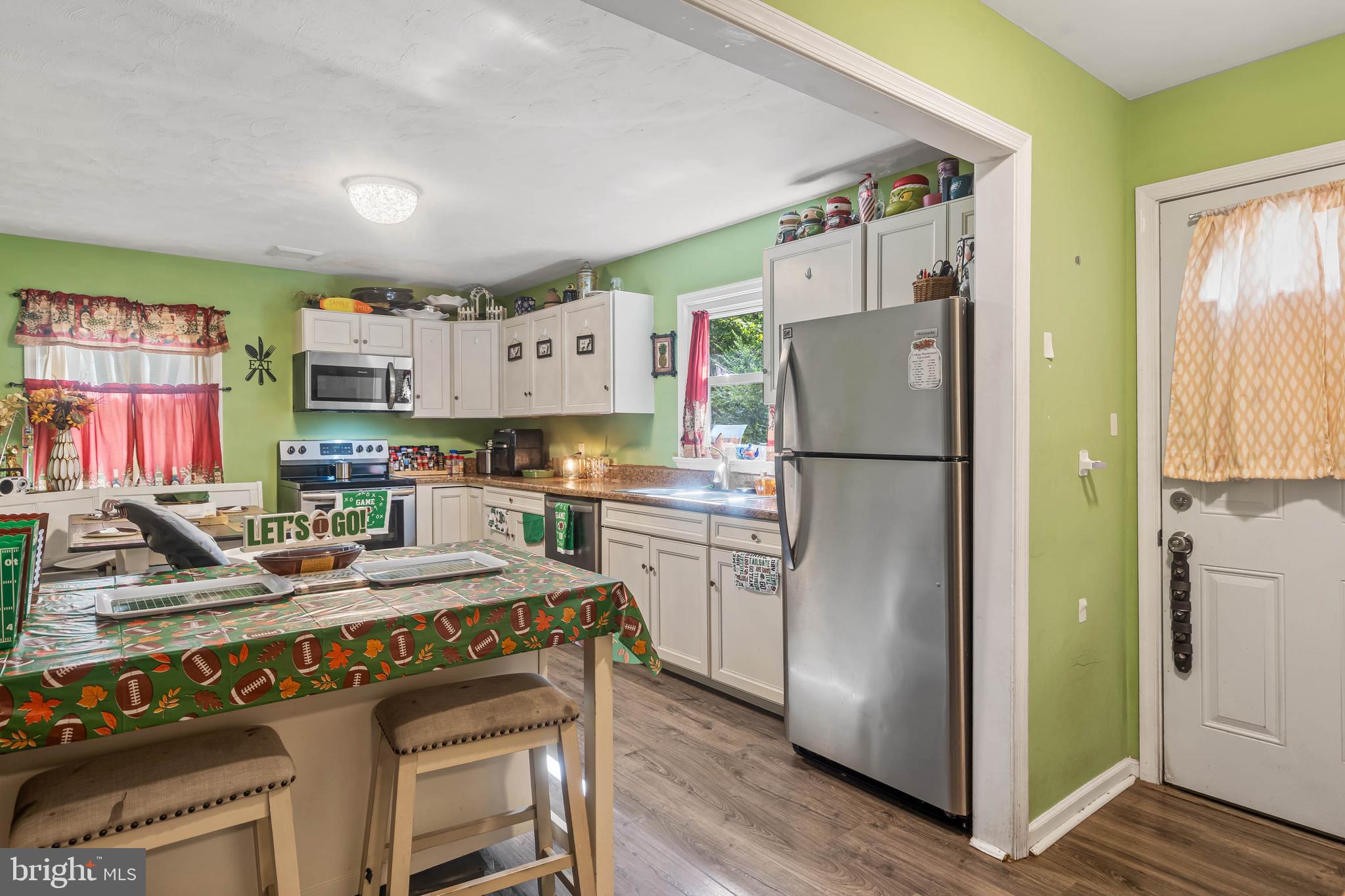 32197 Johnson Road Salisbury, MD 21804 - Photo 6 of 23 a kitchen with refrigerator and cabinets