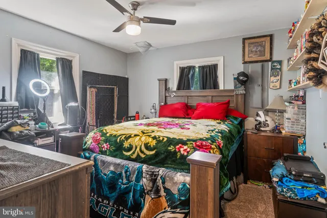 a bedroom with a bed and a dresser