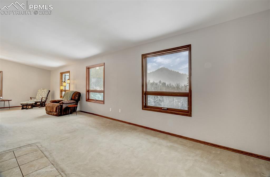 5865 Waterfall Loop Manitou Springs, CO 80829 - Photo 11 of 45 View of the living room highlighting the views! Just imagine relaxing and soaking in these mountain views...