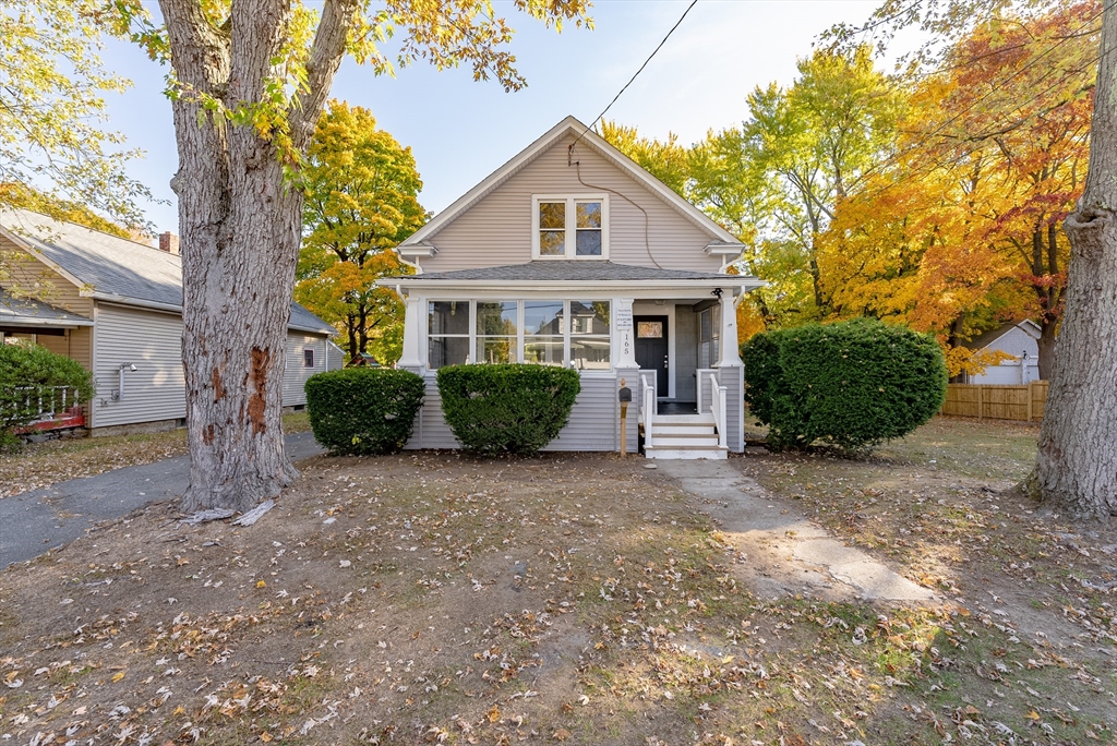 165 Laurelton Street Springfield, MA 01109 - Photo 1 of 31 a front view of a house with a garden