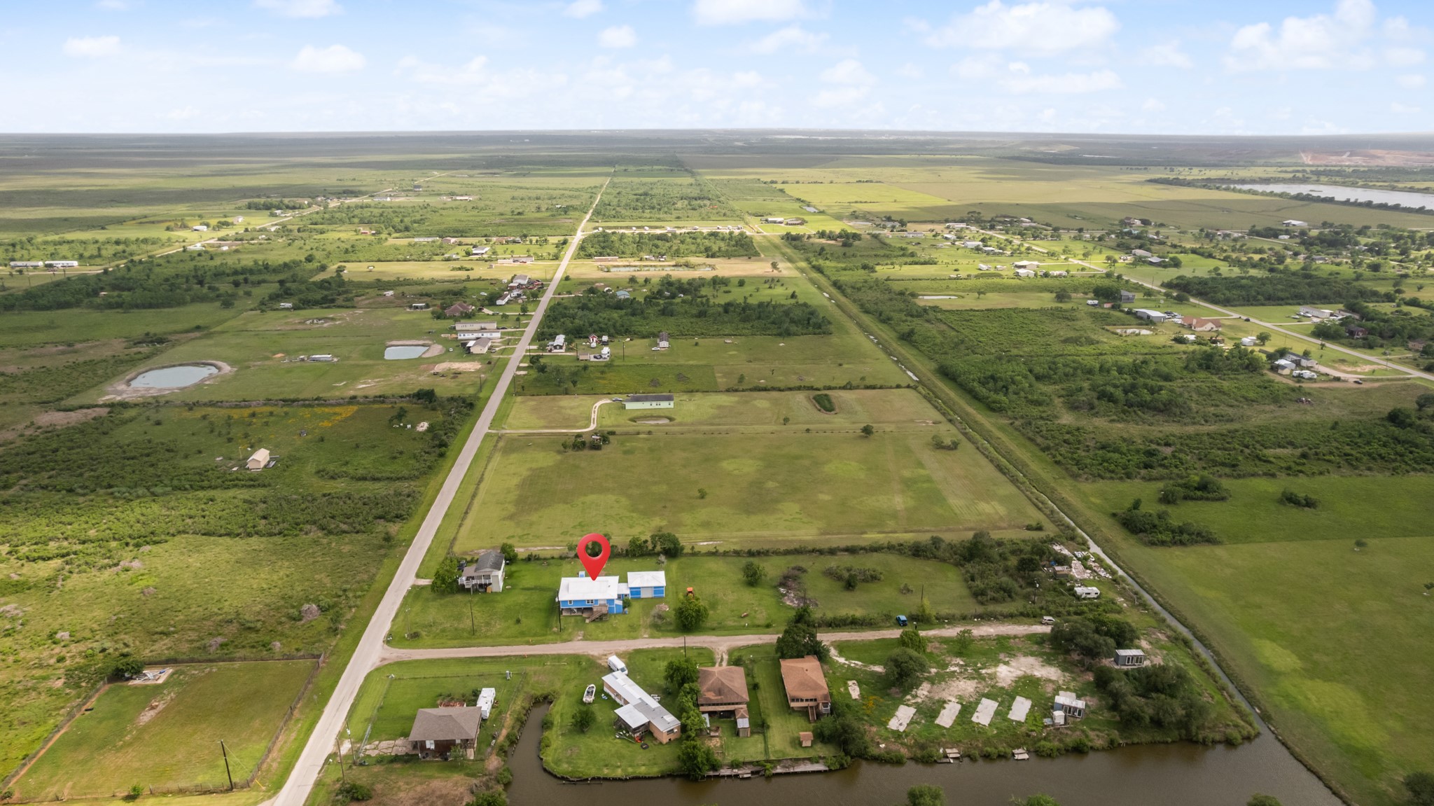 2534 Bastrop Angleton, TX 77515 - Photo 2 of 50 Expansive aerial perspective showcasing the property’s generous lot size, open surroundings, and peaceful rural setting. Convenient access roads and nearby waterways add to the property’s versatile outdoor appeal and wide-open Angleton landscape.