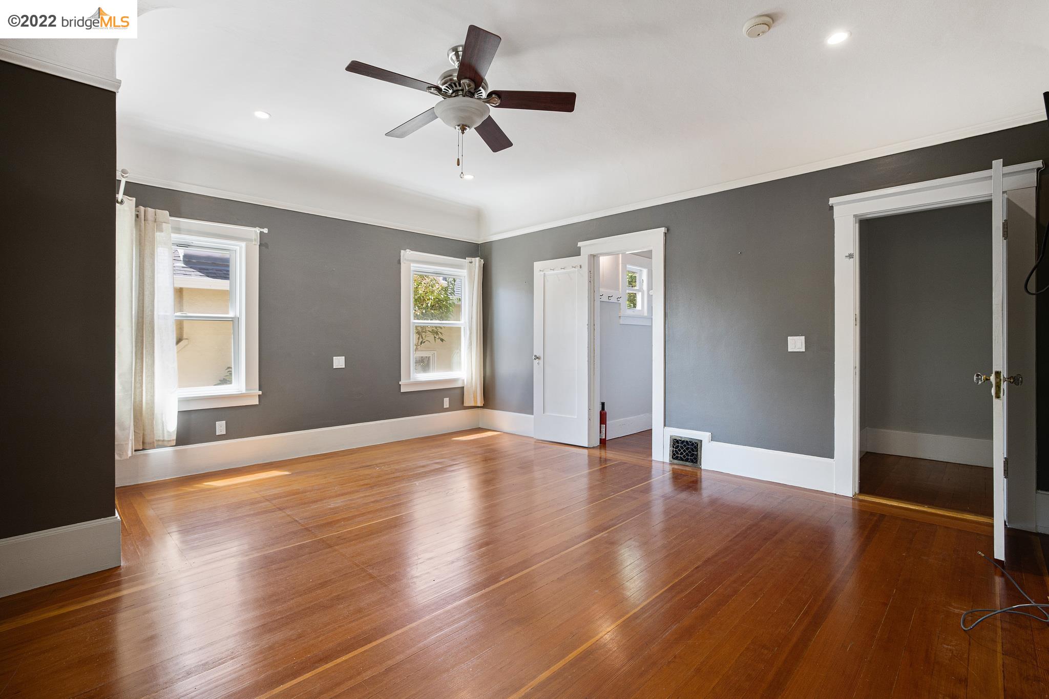 Undisclosed Address Berkeley, CA 94705 - Photo 12 of 28 a view of an empty room with wooden floor and a window
