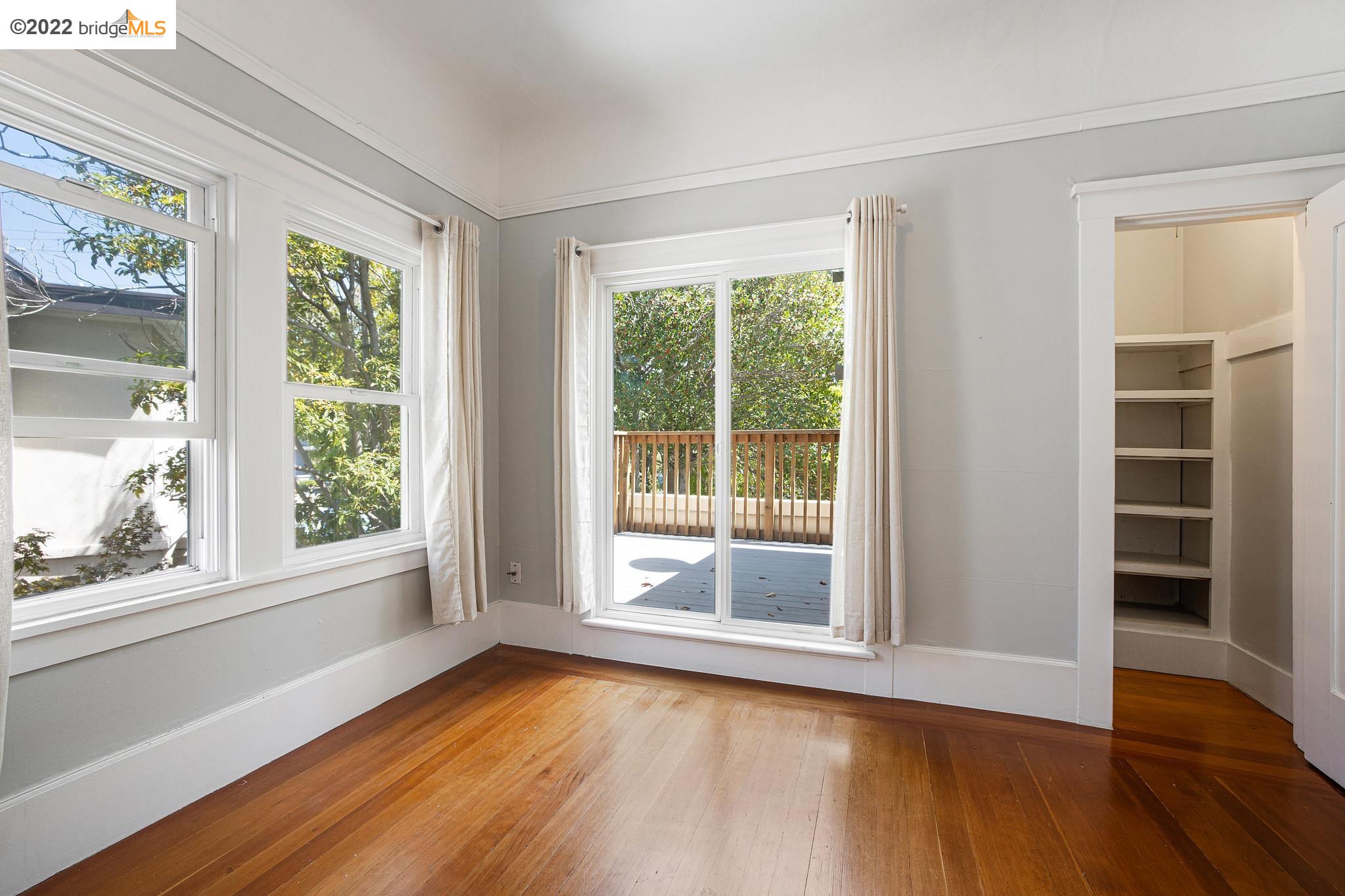 Undisclosed Address Berkeley, CA 94705 - Photo 14 of 28 a view of an empty room with wooden floor and a window