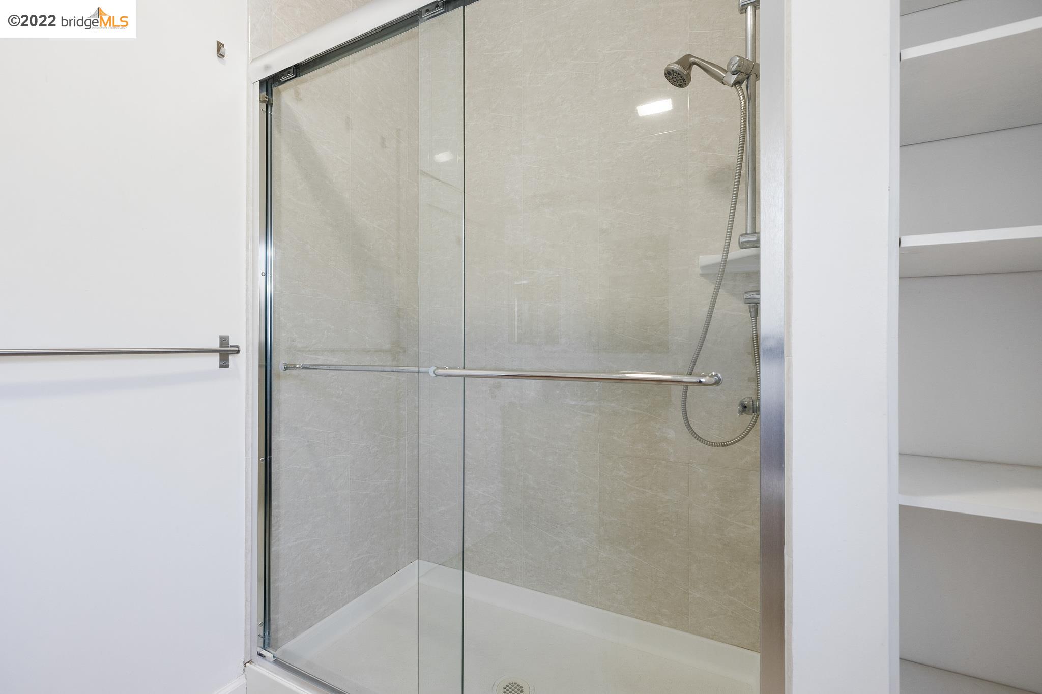 Undisclosed Address Berkeley, CA 94705 - Photo 21 of 28 a bathroom with a glass shower door