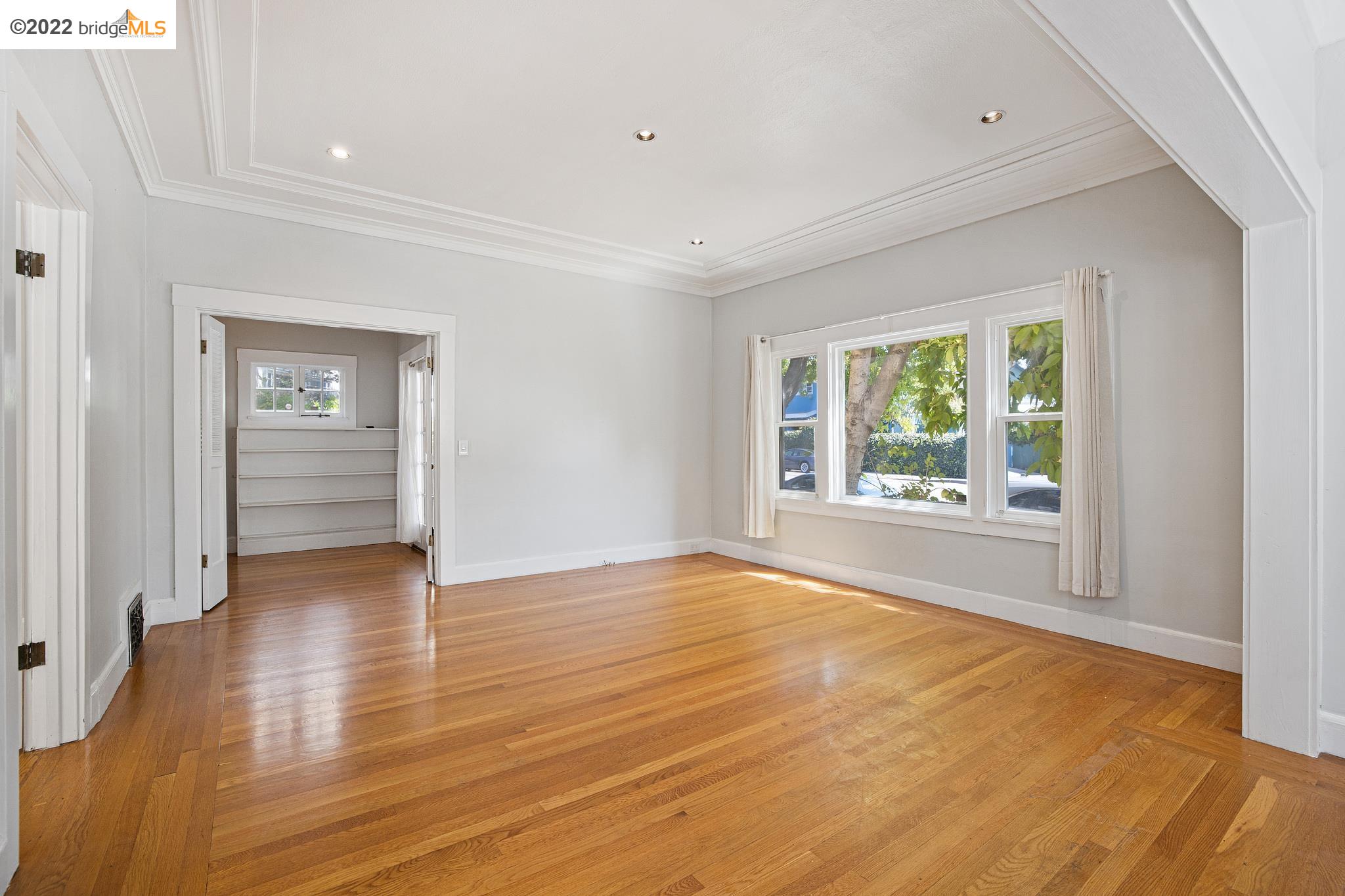 Undisclosed Address Berkeley, CA 94705 - Photo 4 of 28 wooden floor in an empty room with a window