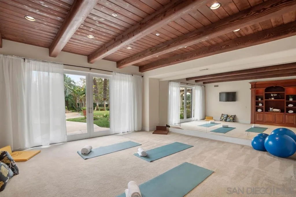 15611 Via De Santa Fe Rancho Santa Fe, CA 92067 - Photo 11 of 25 a bedroom with furniture and large windows