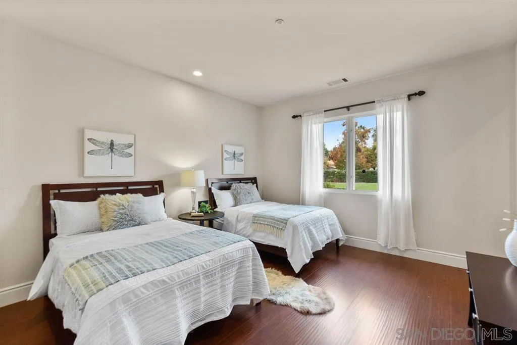 15611 Via De Santa Fe Rancho Santa Fe, CA 92067 - Photo 13 of 25 a bedroom with two beds and wooden floor