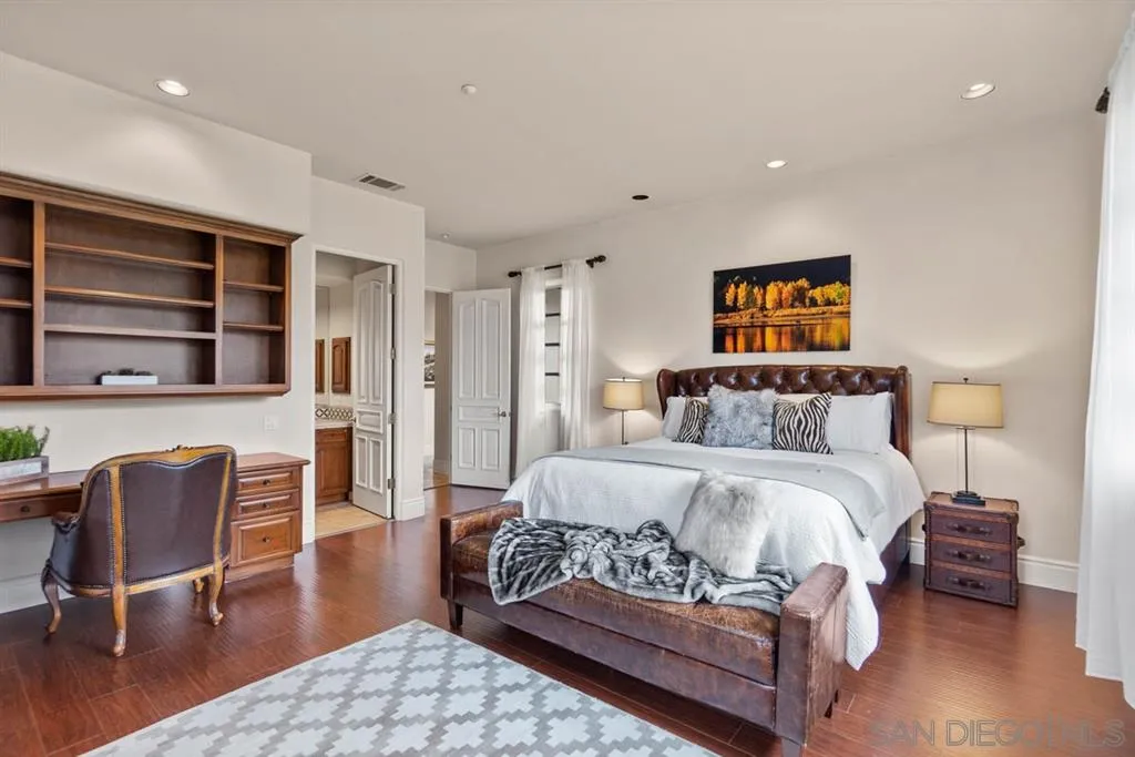 15611 Via De Santa Fe Rancho Santa Fe, CA 92067 - Photo 15 of 25 a bedroom with a bed window and chair