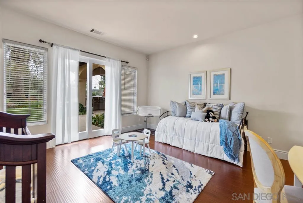 15611 Via De Santa Fe Rancho Santa Fe, CA 92067 - Photo 17 of 25 a living room with furniture and a rug