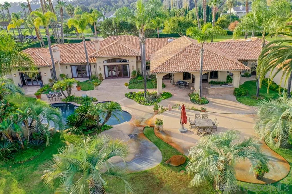 15611 Via De Santa Fe Rancho Santa Fe, CA 92067 - Photo 2 of 25 an aerial view of a house with garden space and a patio