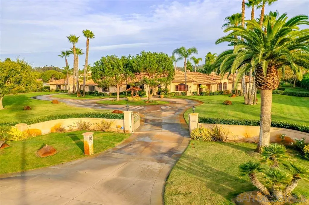 15611 Via De Santa Fe Rancho Santa Fe, CA 92067 - Photo 24 of 25 a view of a swimming pool with a lawn chairs next to yard
