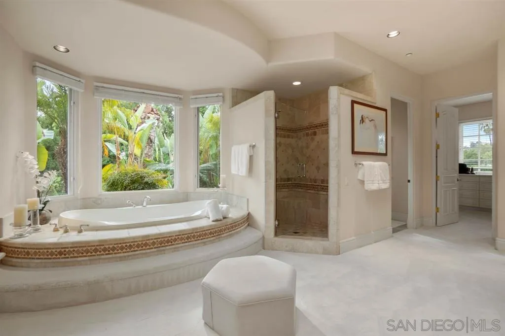 15611 Via De Santa Fe Rancho Santa Fe, CA 92067 - Photo 10 of 25 a spacious bathroom with a bathtub and sink