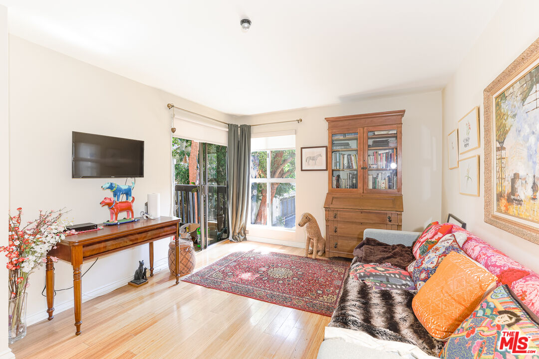 8105 Raintree Circle Culver City, CA 90230 - Photo 1 of 17 a living room with furniture and a flat screen tv