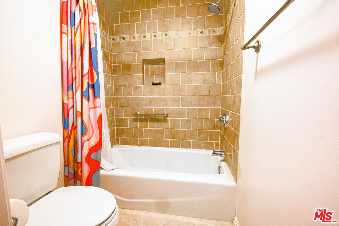 8105 Raintree Circle Culver City, CA 90230 - Photo 11 of 17 a bathroom with a bathtub and shower
