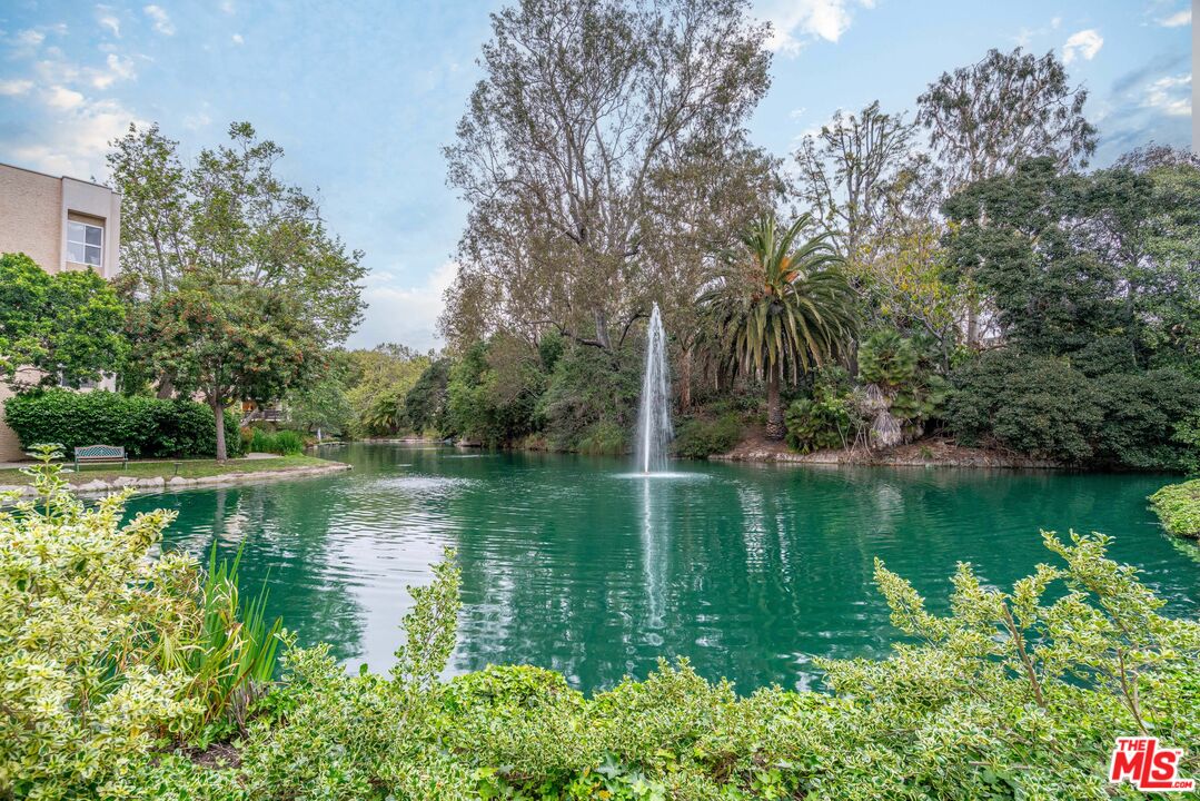 8105 Raintree Circle Culver City, CA 90230 - Photo 13 of 17 a view of a lake with a house in the background
