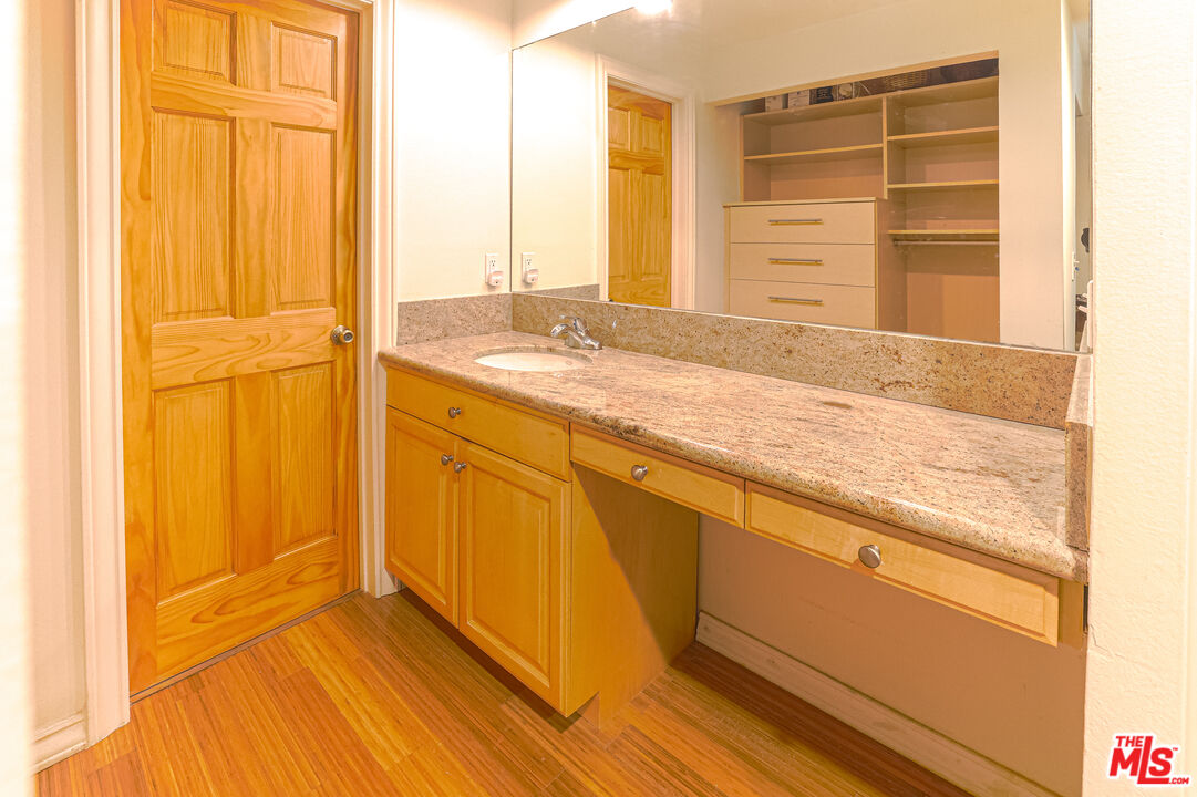 8105 Raintree Circle Culver City, CA 90230 - Photo 3 of 17 a view of walk in closet with empty racks