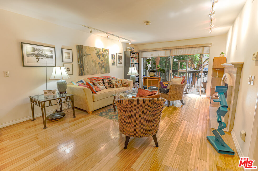 8105 Raintree Circle Culver City, CA 90230 - Photo 4 of 17 a living room with furniture and a wooden floor