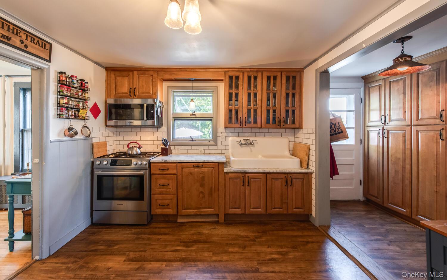 21 Prospect Street Brewster, NY 10509 - Photo 15 of 47 a kitchen with stainless steel appliances granite countertop a refrigerator and a stove top oven