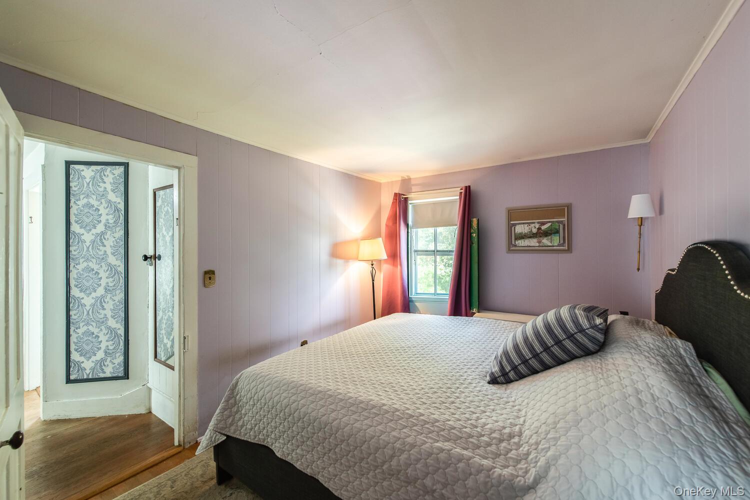 21 Prospect Street Brewster, NY 10509 - Photo 30 of 47 a bedroom with a large bed and wooden floor