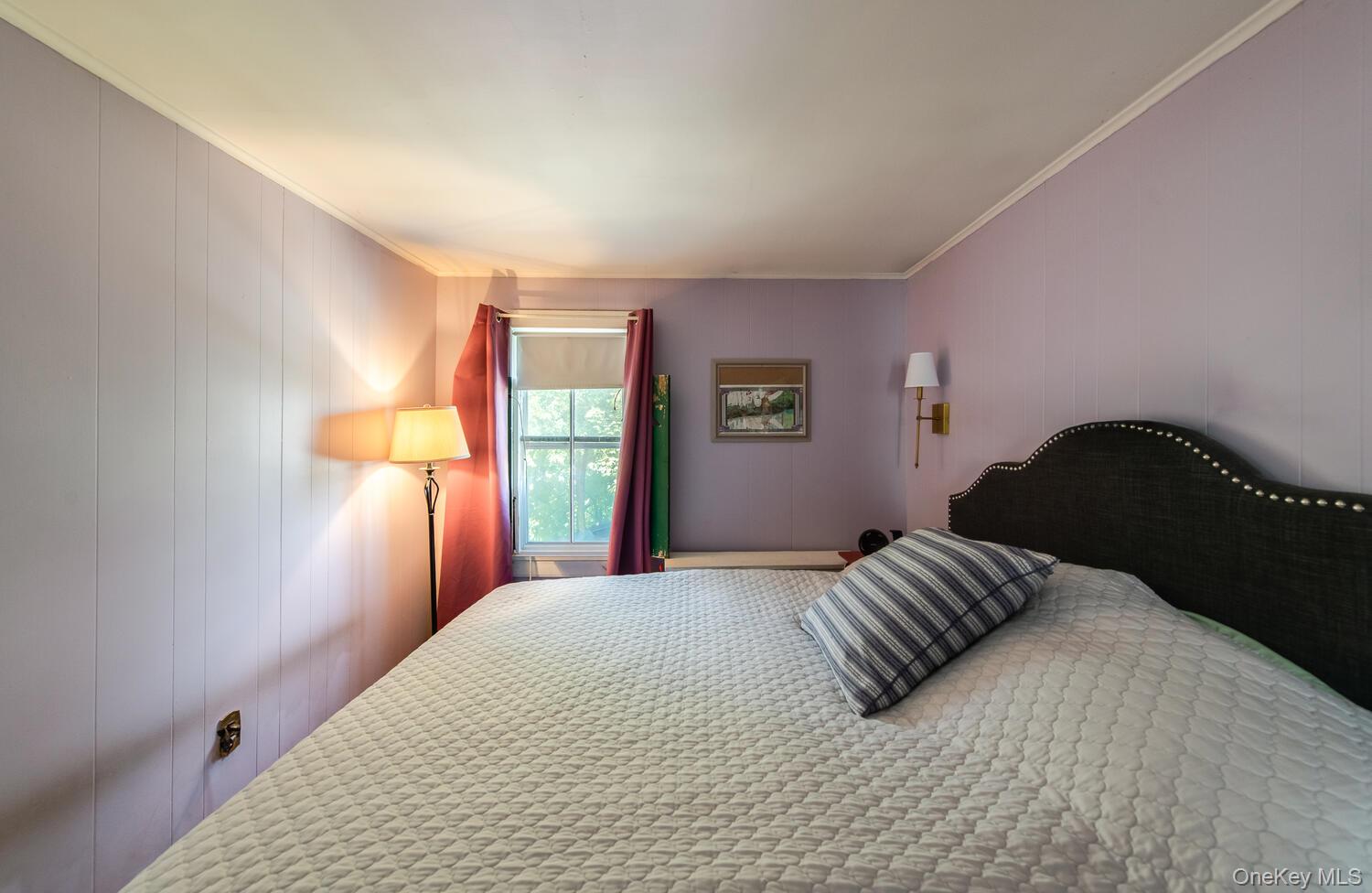 21 Prospect Street Brewster, NY 10509 - Photo 31 of 47 a bedroom with a bed and a window