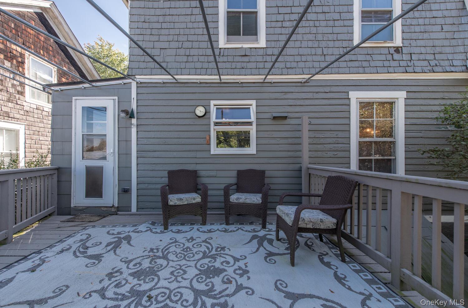 21 Prospect Street Brewster, NY 10509 - Photo 35 of 47 a backyard of a house with barbeque oven table and chairs