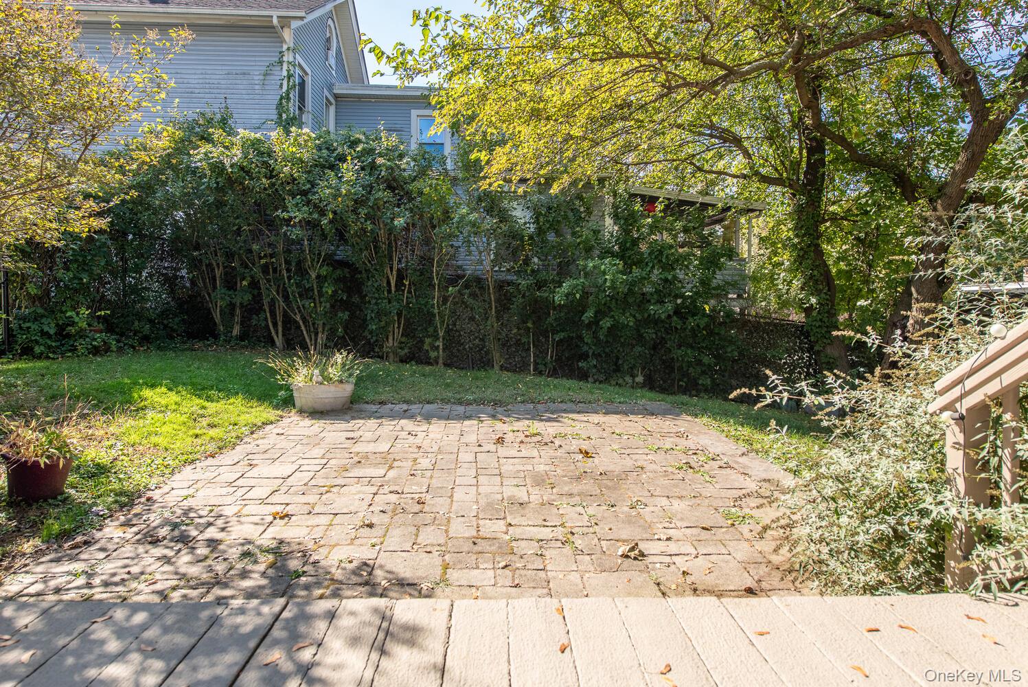 21 Prospect Street Brewster, NY 10509 - Photo 43 of 47 a view of a yard with plants and trees