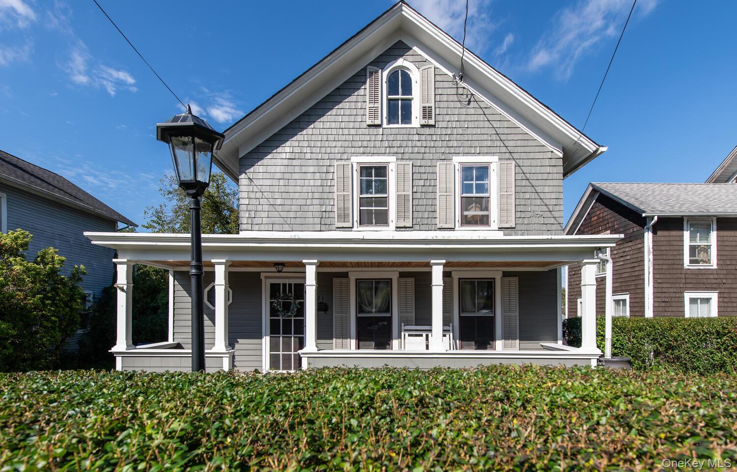 21 Prospect Street Brewster, NY 10509 - Photo 45 of 47 a front view of a house with a garden
