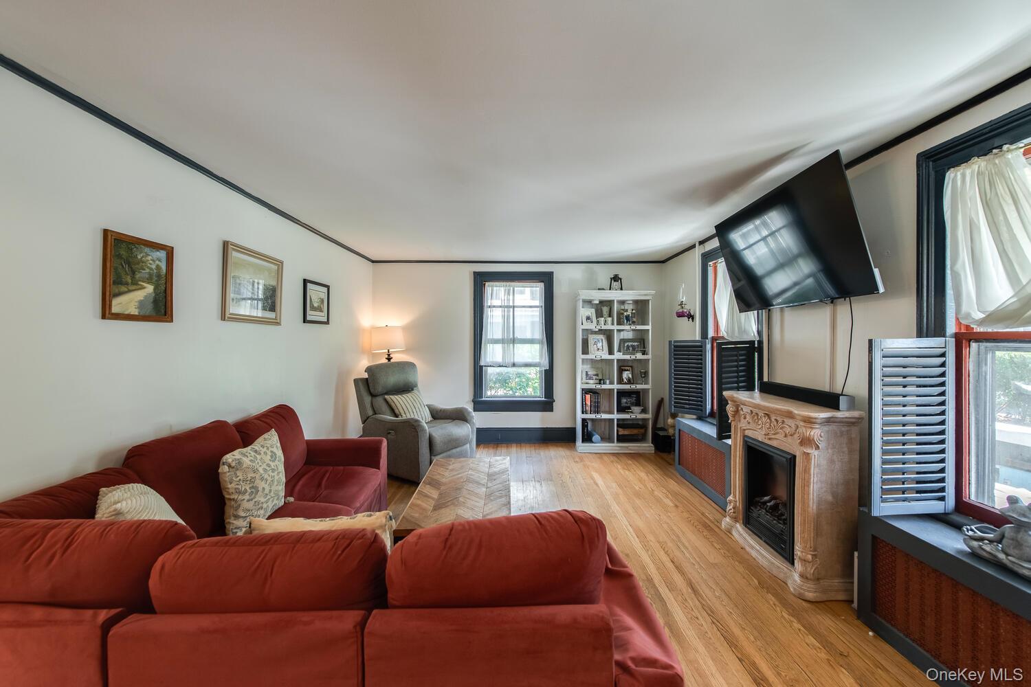21 Prospect Street Brewster, NY 10509 - Photo 6 of 47 a living room with furniture fireplace and flat screen tv