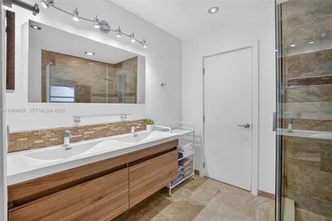 a bathroom with a sink and a mirror