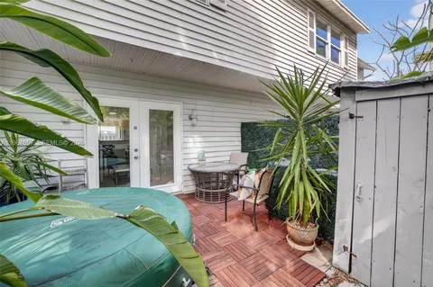 a view of a backyard with sitting area