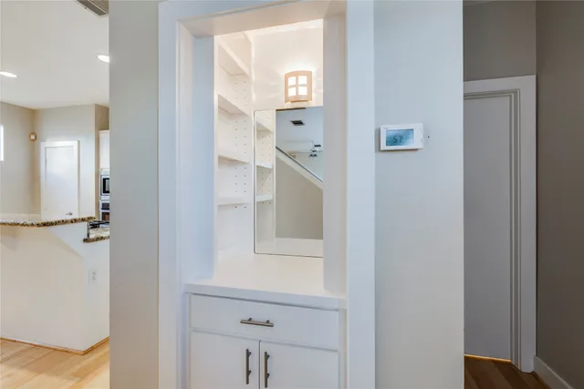 a bathroom with a mirror and a shower