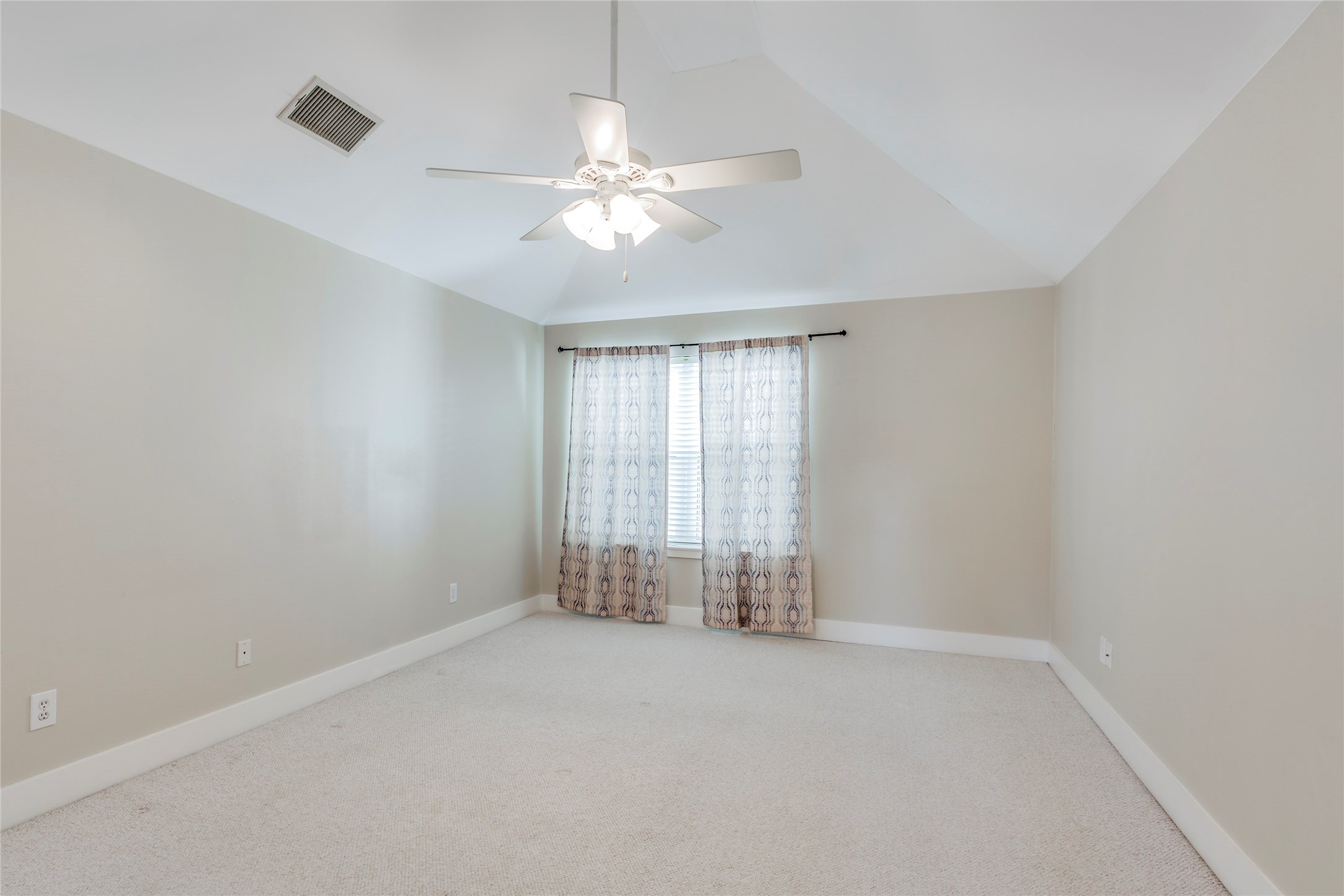 609 Lester Street Houston, TX 77007 - Photo 15 of 31 an empty room with chandelier fan and windows