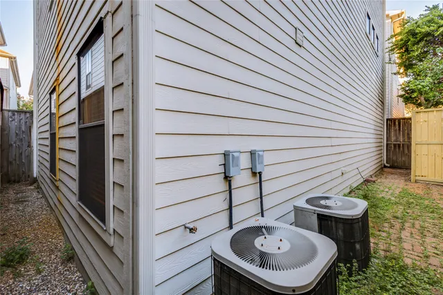 a view of a chairs and table in the backyard