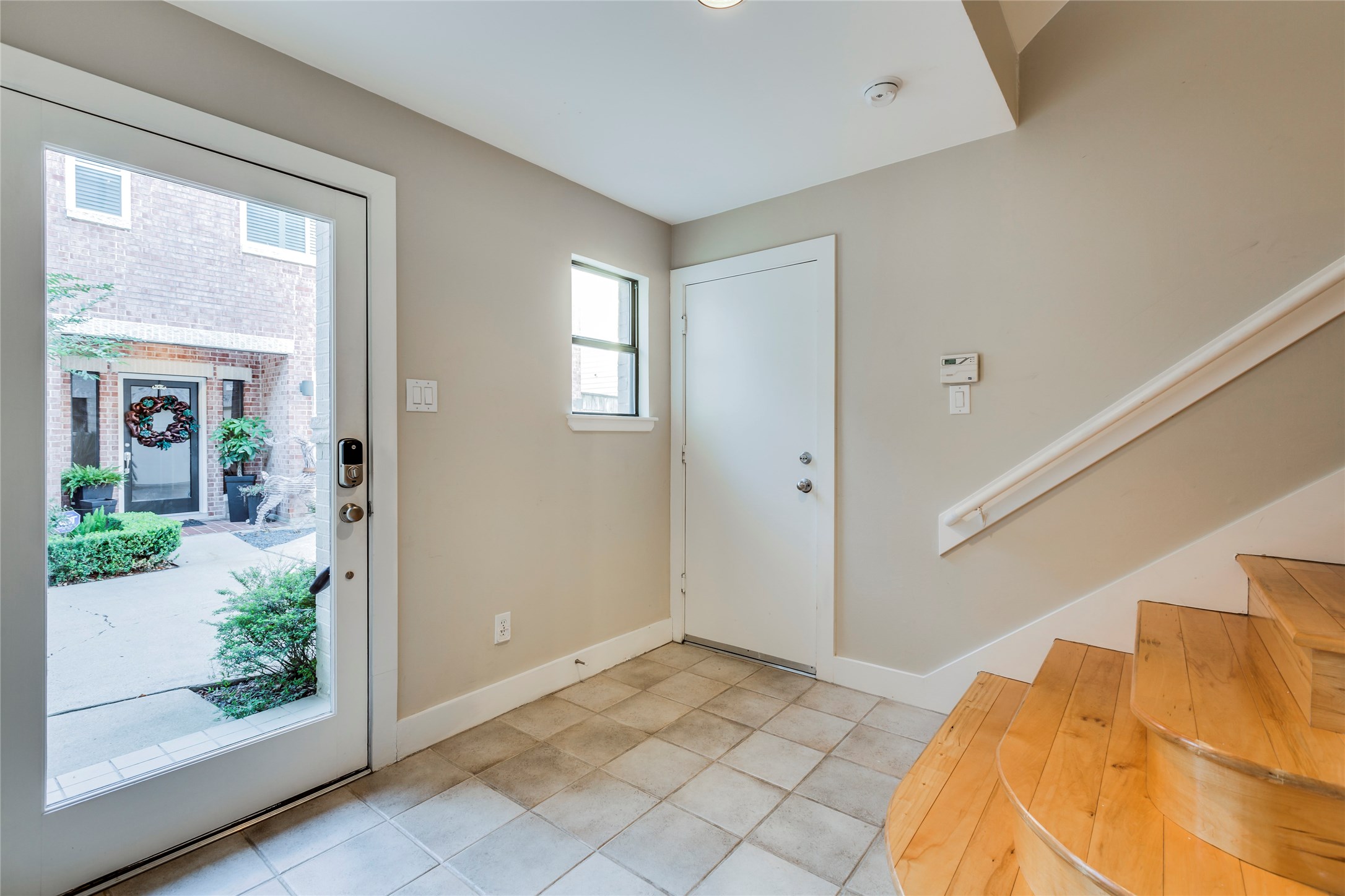 609 Lester Street Houston, TX 77007 - Photo 3 of 31 a view of a bedroom with wooden floor and windows