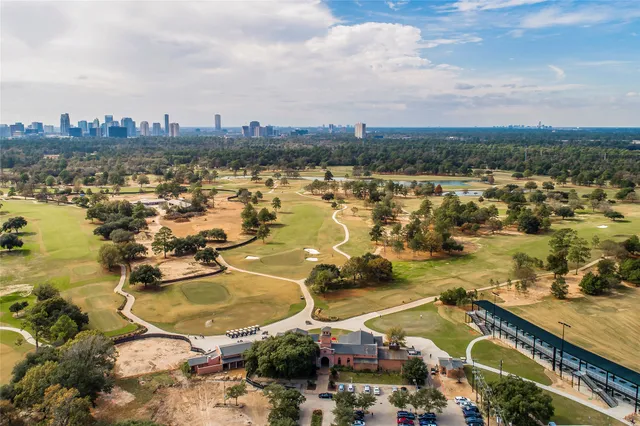 an aerial view of residential building and ocean view