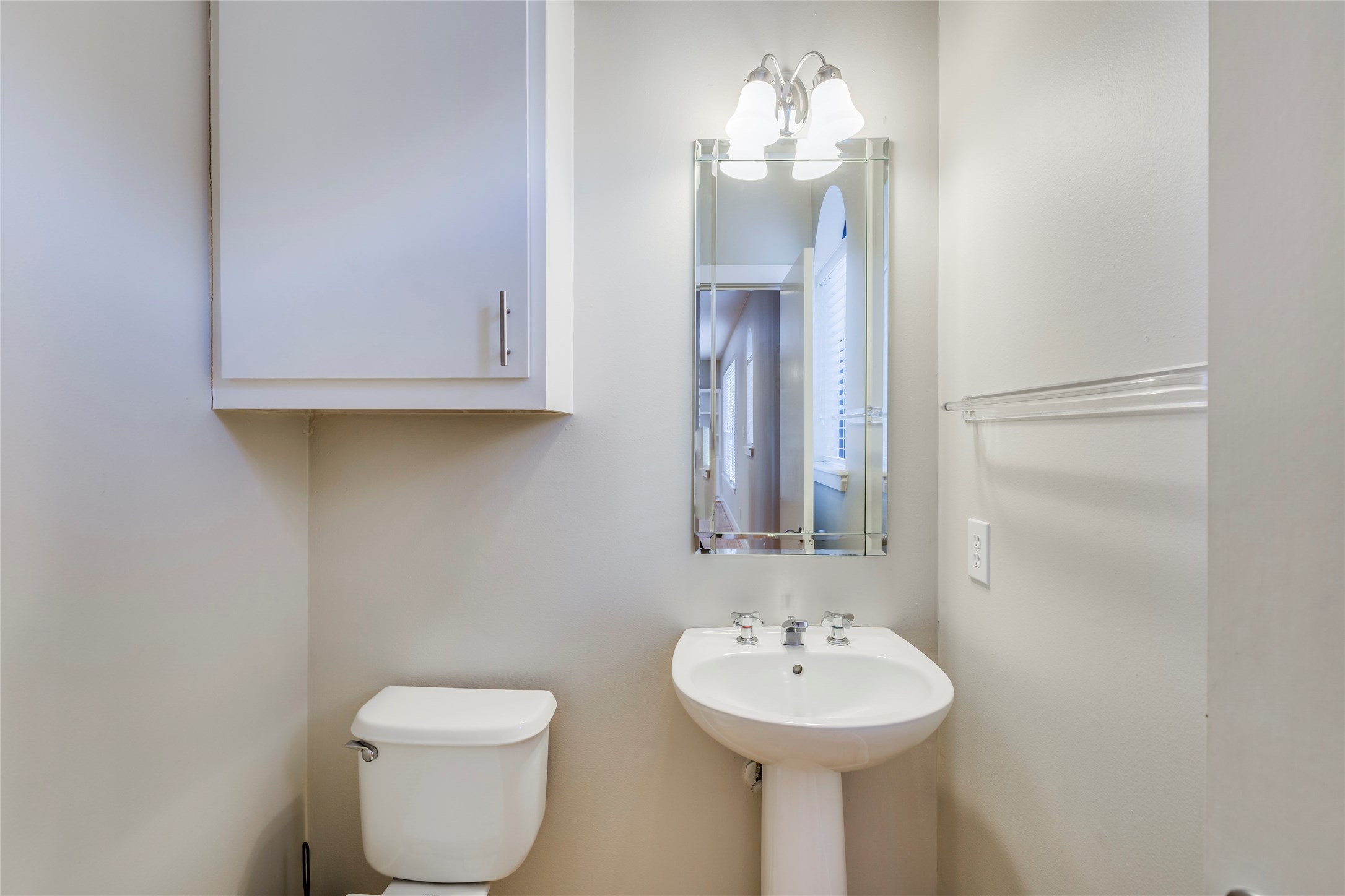 609 Lester Street Houston, TX 77007 - Photo 10 of 31 a bathroom with a toilet sink and mirror