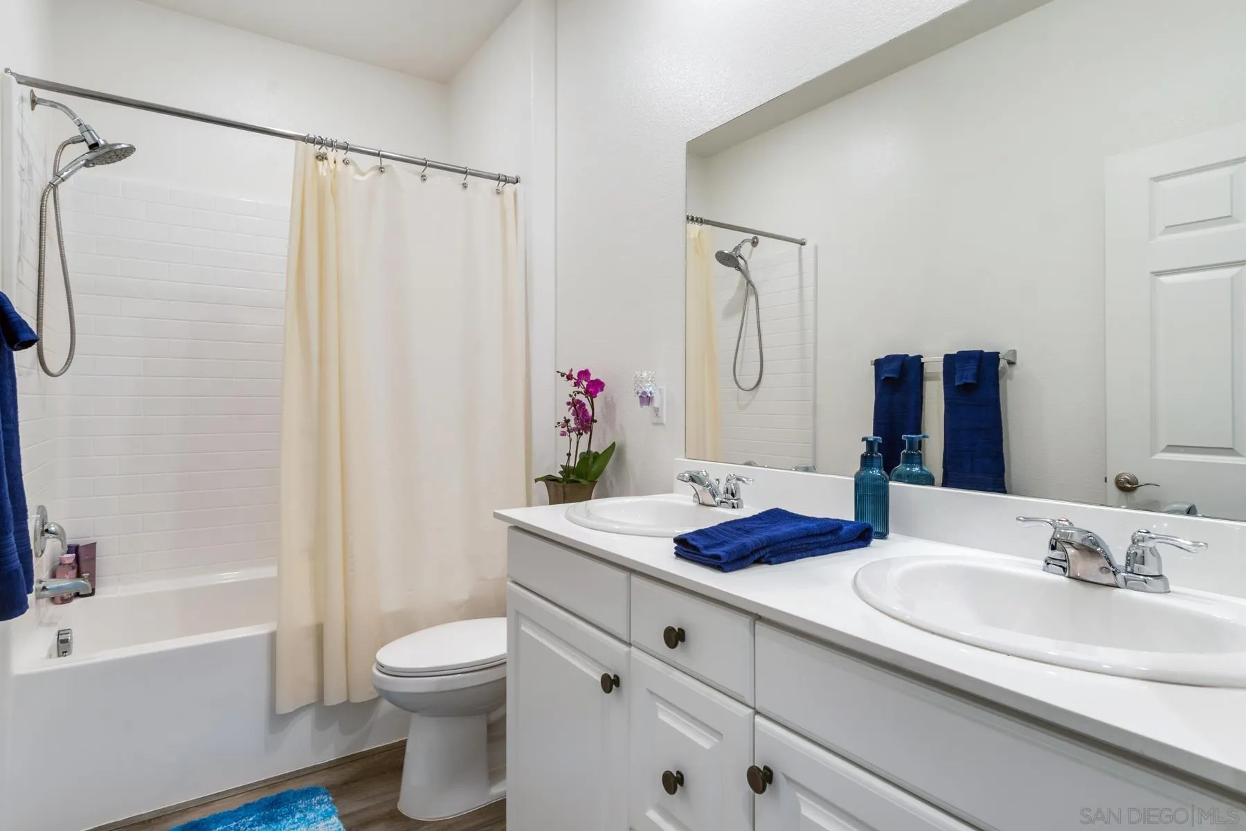 1484 Wicklow Avenue Redlands, CA 92374 - Photo 20 of 35 a bathroom with a granite countertop sink toilet and shower