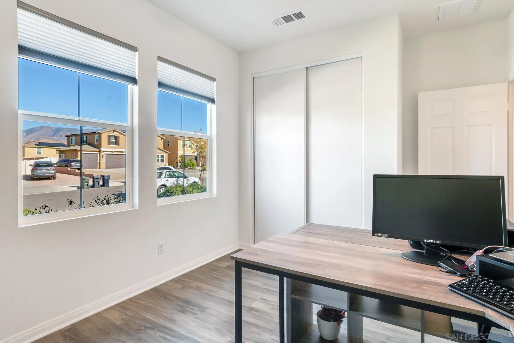 1484 Wicklow Avenue Redlands, CA 92374 - Photo 22 of 35 a bedroom with a bed and a flat screen tv
