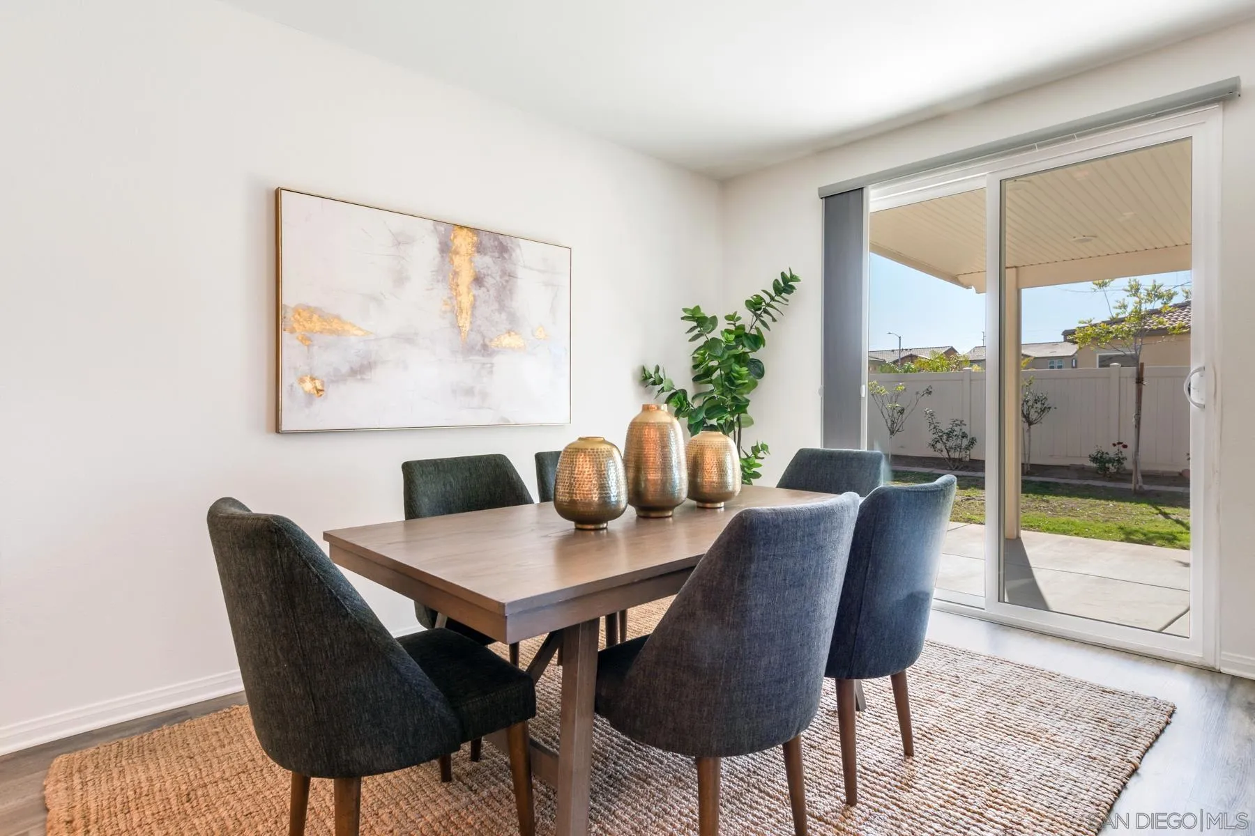 1484 Wicklow Avenue Redlands, CA 92374 - Photo 6 of 35 a view of a dining room with furniture wooden floor and a potted plant