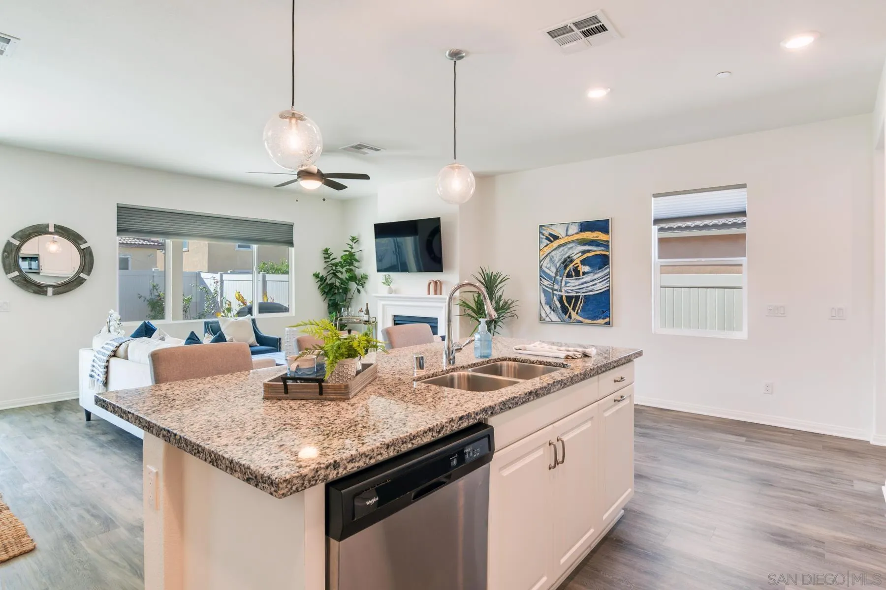 1484 Wicklow Avenue Redlands, CA 92374 - Photo 9 of 35 a kitchen with granite countertop cabinets a sink a window and stainless steel appliances