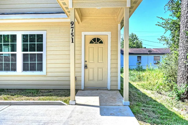 a view of entrance door of the house and front of house