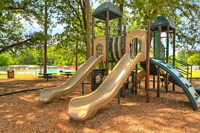 a view of a swimming pool with a bench