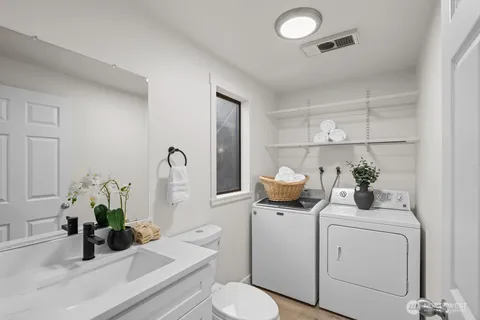 a view of bathroom with a sink and toilet
