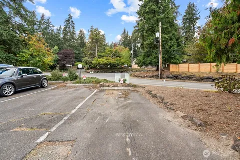 a view of street with parked cars