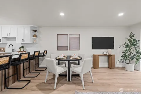 a view of a livingroom with furniture and a flat screen tv