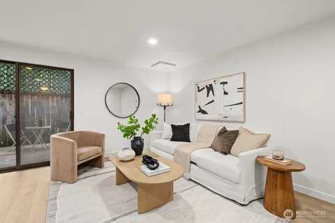 a living room with furniture flowerpot and window
